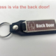 Picture of a keyring with back door pic on it